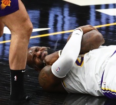 WATCH: LeBron James fakes injury; demands attention