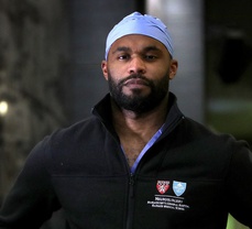 Former Titan Myron Rolle has exchanged the helmet for the surgical mask